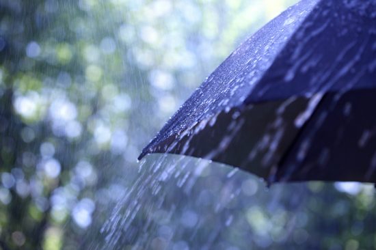 bigstock-Rain-drops-falling-from-a-blac-46512508